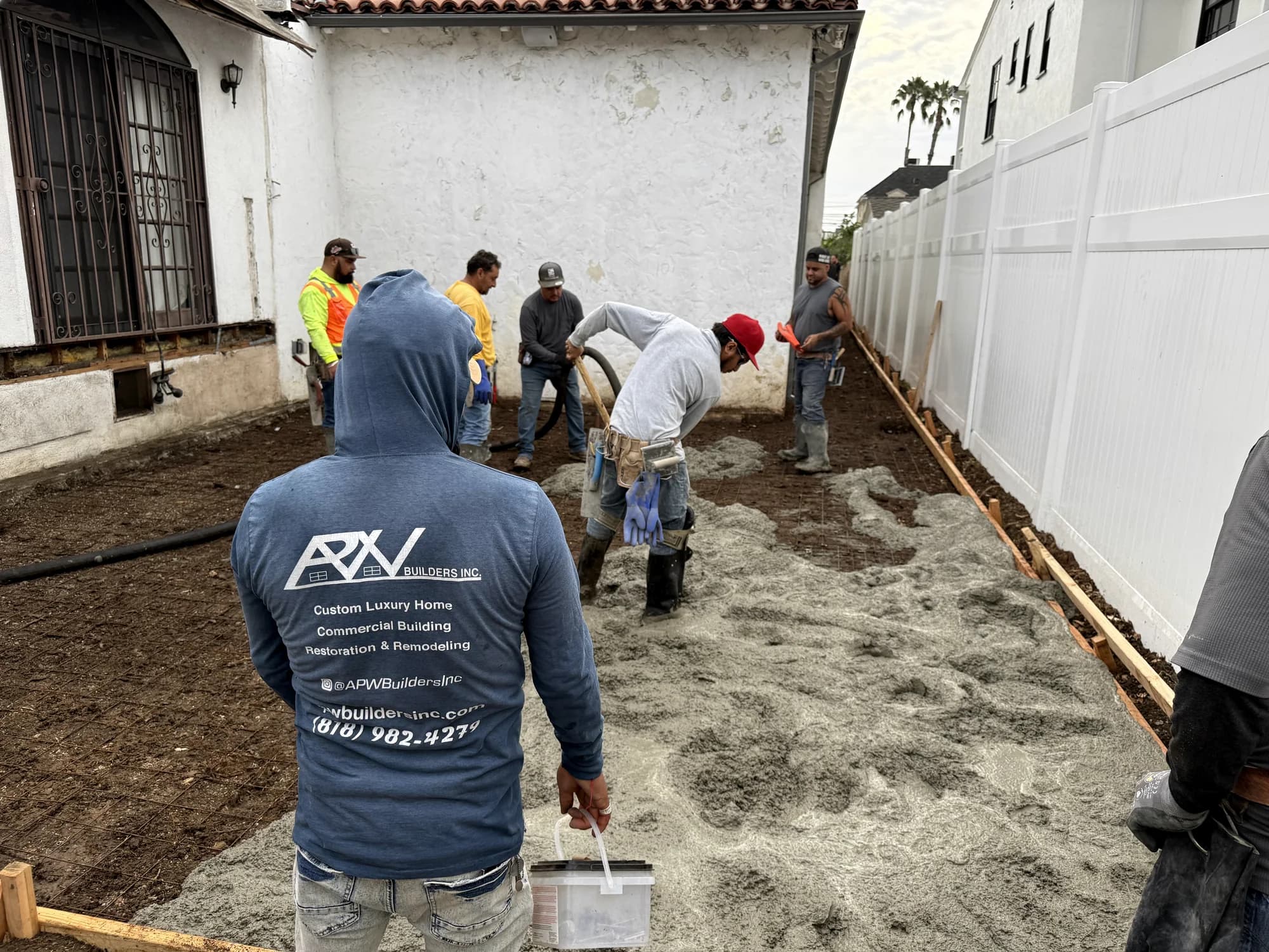 APW Builders crew working on a residential site