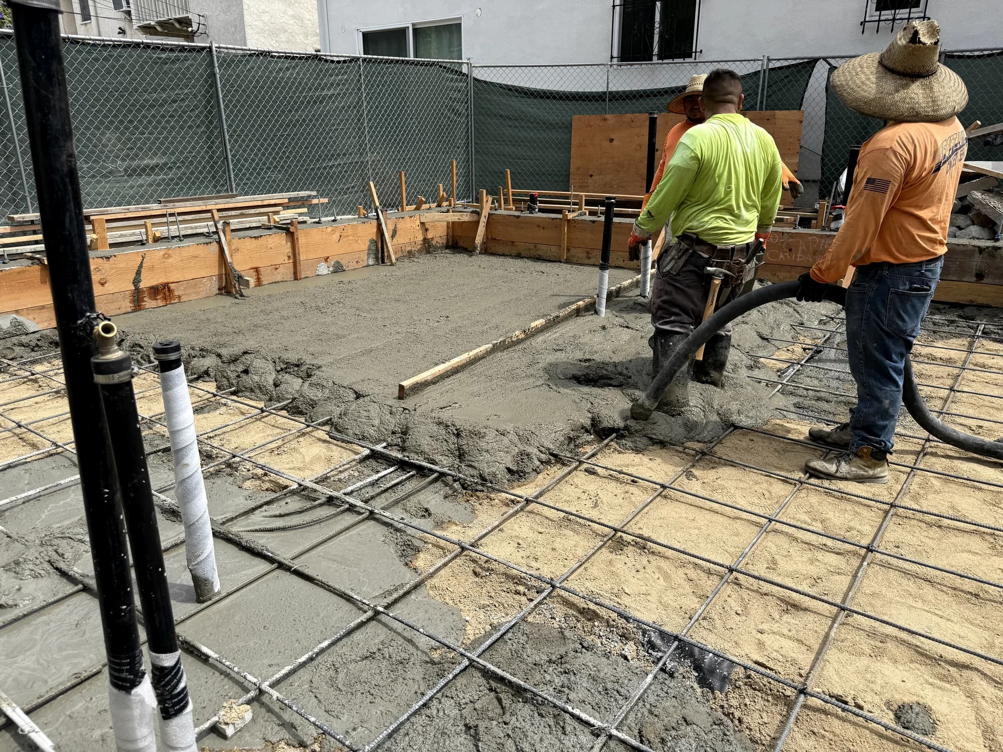 Crew placing and screeding concrete