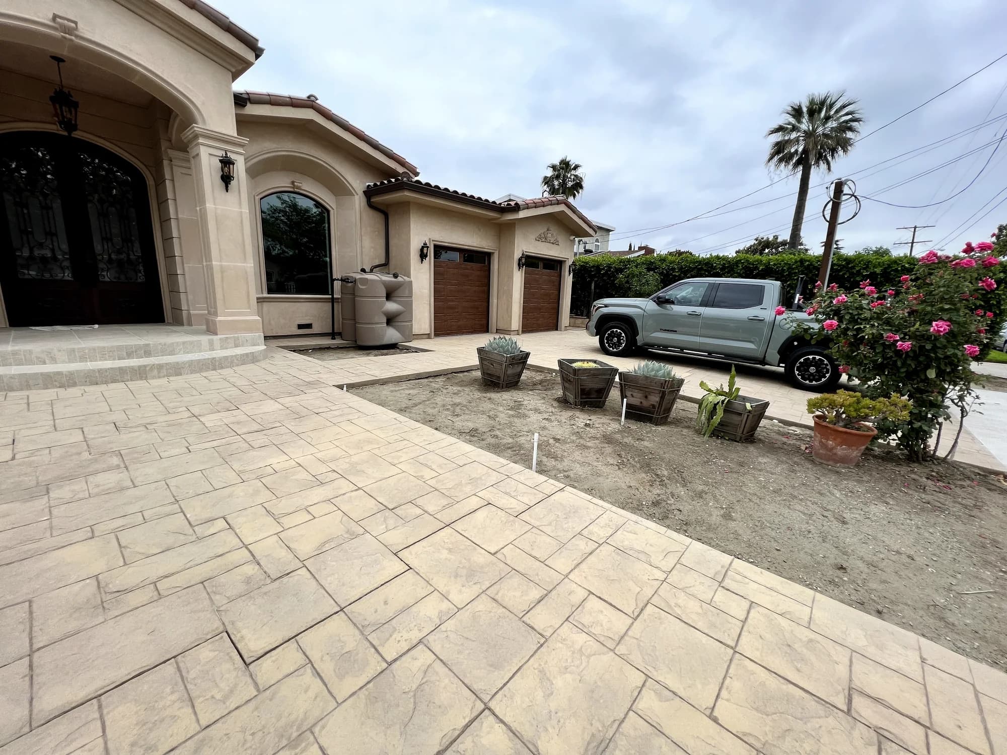 Mediterranean estate with stone driveway