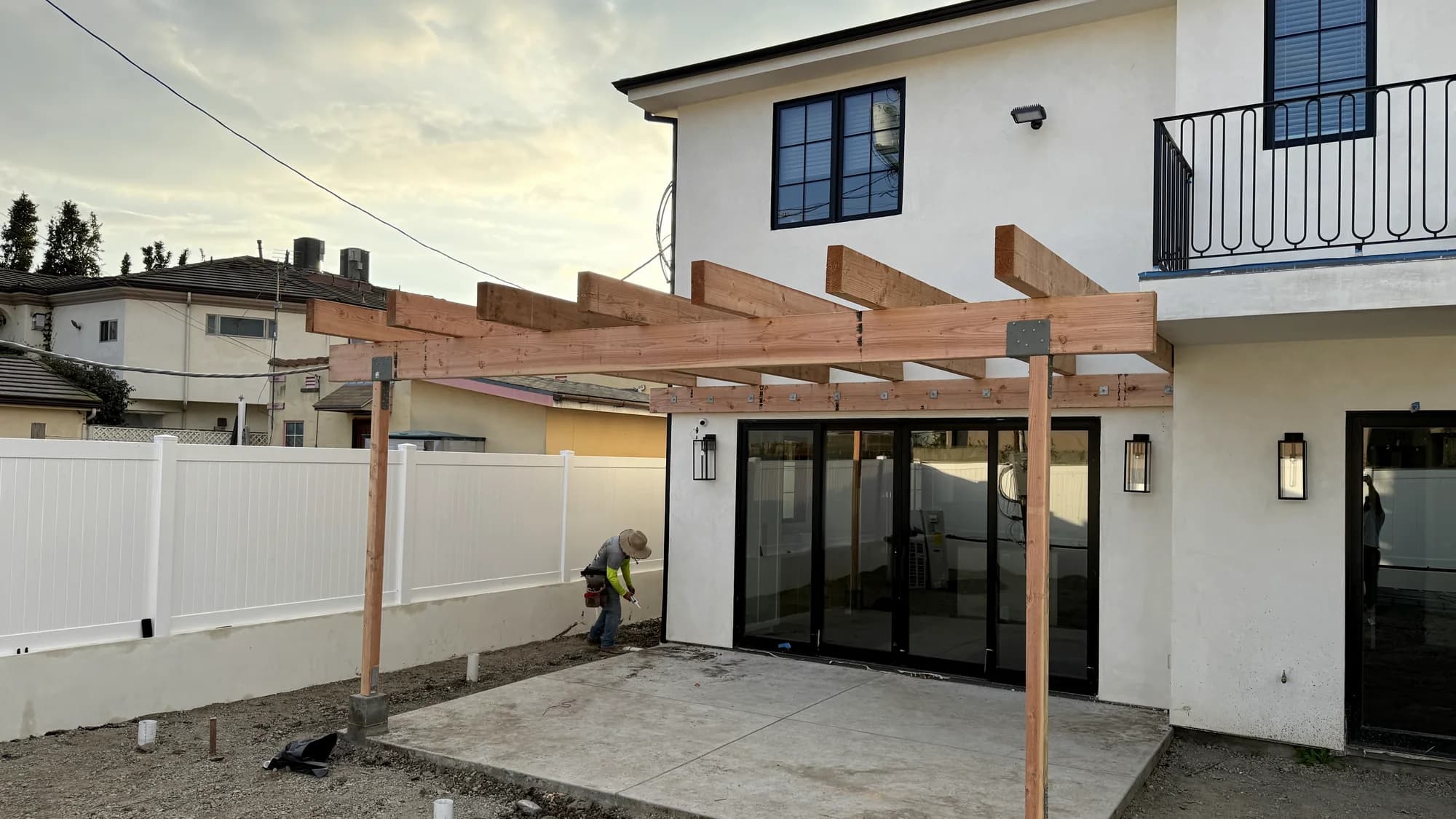 Completed contemporary custom home with covered patio, built by APW Builders